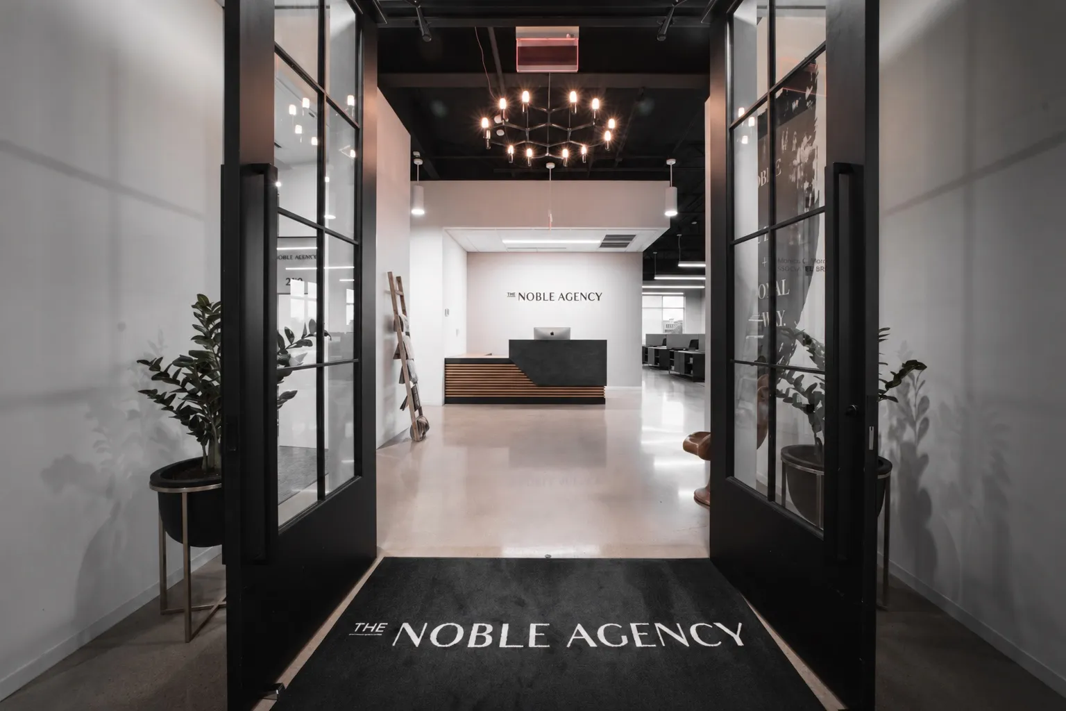 The Noble Agency office entrance in Scottsdale, doors open onto the reception desk